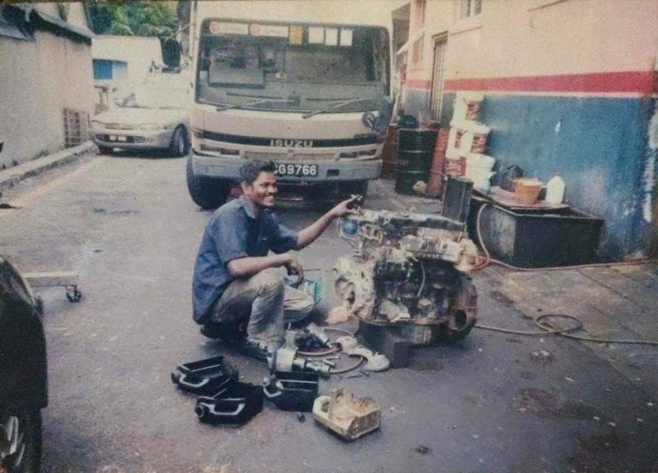 Kannan working on an engine at the workshop
